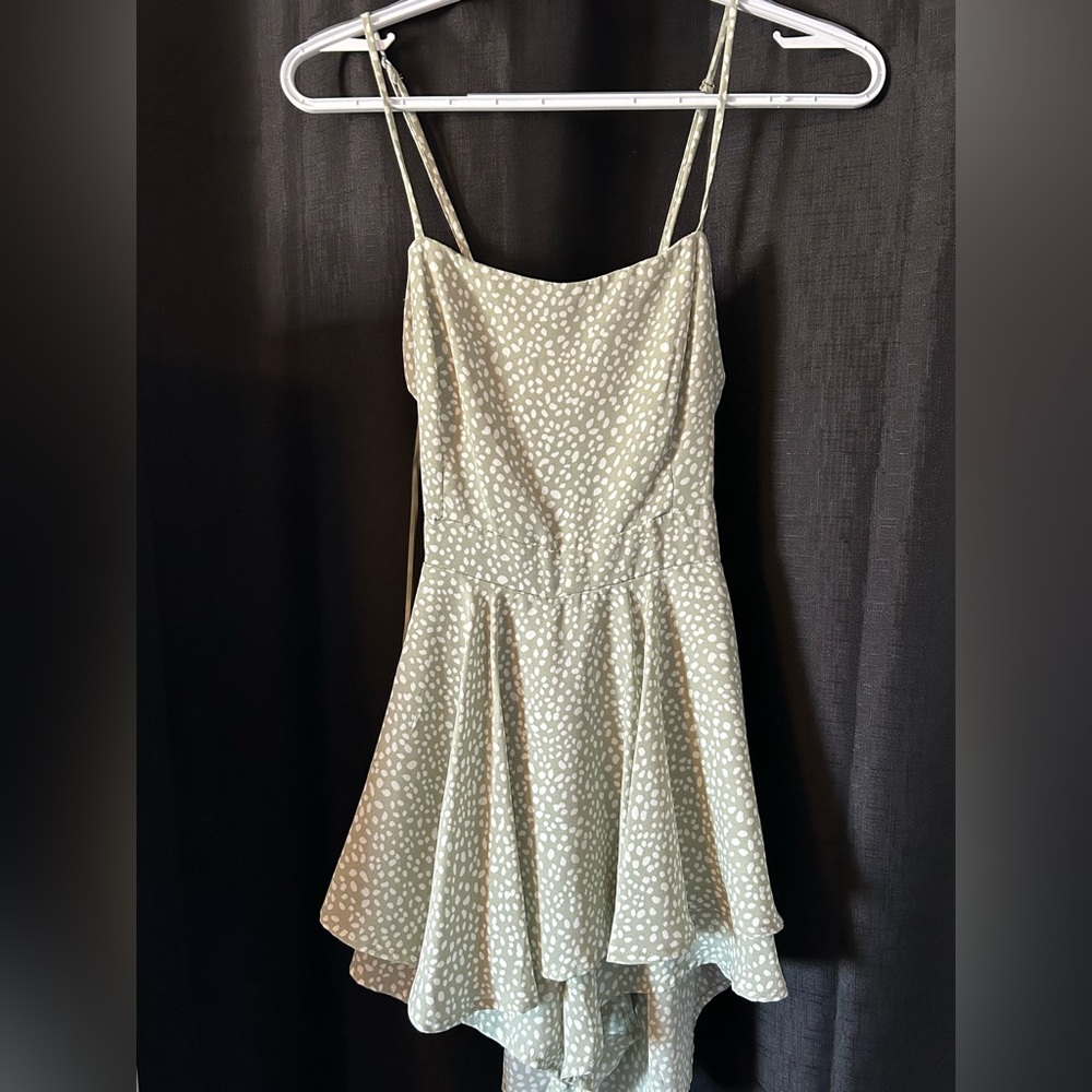 Super cute green romper with white spots! Size medium.